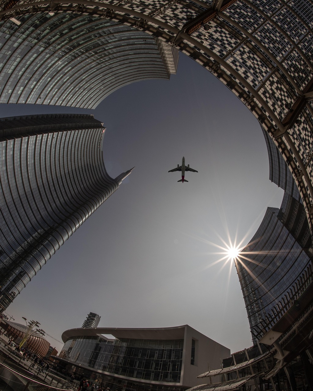 plane, city, nature, architecture, sky, airplane, flight, travel, sun, urban, buildings, tourism, outdoors, transportation, cityscape, skyline, tower, skyscrapers, lookup, aircraft